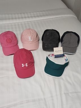 Lot Of Baseball Caps And Visor